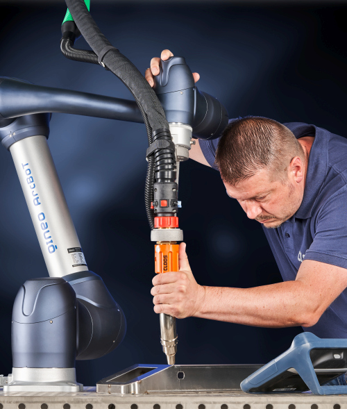 CLOOS ArcBoT collaborative welding cobot performing automated MIG welding on fixture
