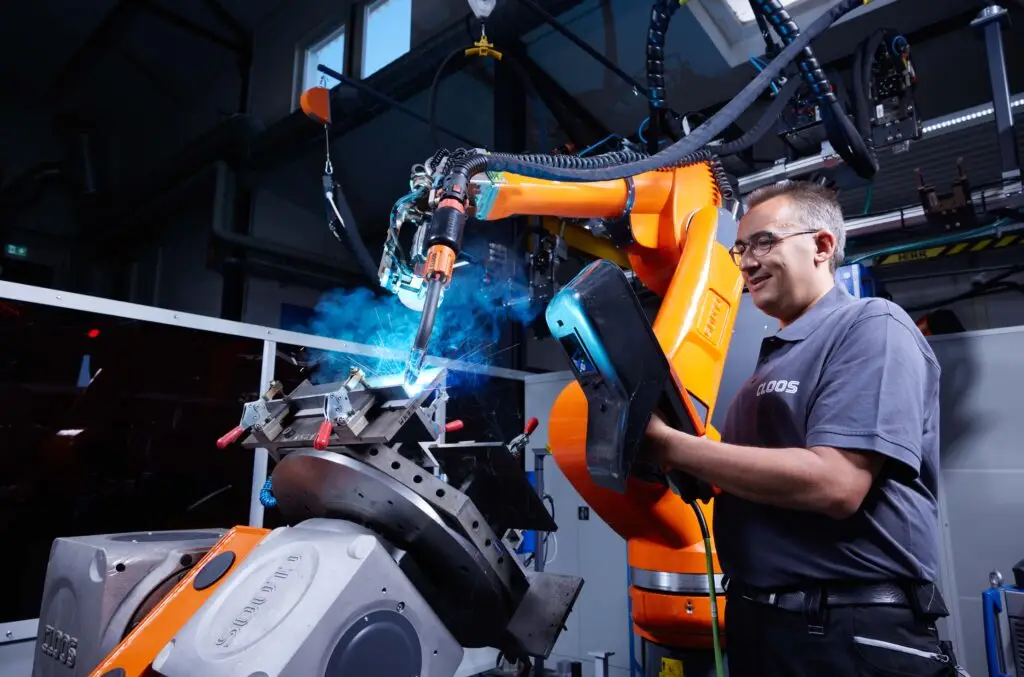 CLOOS robotic welding system in operation at manufacturing facility