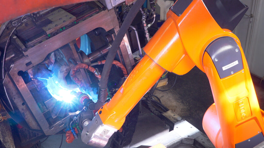 CLOOS service and repair technician maintaining welding system at SAF-Holland facility